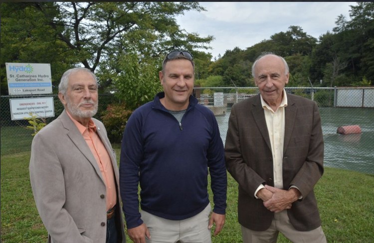 Matt Harris with two others outside the St. Catharines Hydro Generation Inc. station on Lakeport Road