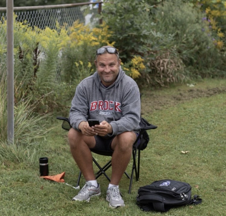 Matt Harris seated at a rest stop along the Big Move Cancer Ride route